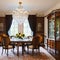 A classic, Georgian-style dining room with a formal table, antique sideboard, and crystal chandelier1, Generative AI