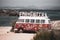 Classic German Volkswagen Transporter van on Es Pujols beach in Formentera in the summer of 2021