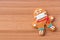 Classic gingerbread cookies man with a medical mask on the table. A gingerbread man cookie in the shape of a man with colored