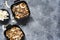 Classic granola - baked oatmeal with nuts, honey and coconut chips. Breakfast on the kitchen table, top view with place for text
