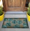 Classic green leaves Outdoor Door mat with twin black borders outside home with yellow flower pots