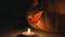Classic Halloween decor of pumpkins with candles