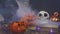 Classic Halloween symbols pumpkins and skulls are filled with smoke slow motion