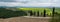 Classic hills of Tuscany with Cypress trees on damp day