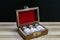 Classic Homeopathy concept - Retro styled Bottles of homeopathic pills in old open wooden box on dark background