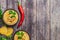 Classic hummus in bowls on wooden table. With copy space. Top view