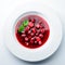 classic Italian food. Beautifully decorated plate with strawberries and raspberries in a ginger juice, dark background, top view