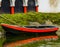 Classic Japanese rowing boat docked at the water side, recreational water sports