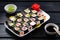 Classic Japanese sushi roll hosomaki with tuna, salmon and shrimp