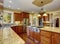 Classic kitchen with hardwood floor, china, and marble counters.