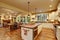 Classic kitchen with hardwood floor and an island.