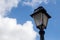 Classic lantern and a blue sky with clouds