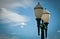 Classic lighting pole against blue sky