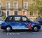 Classic London taxi with Aeroflot advertisement