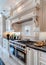Classic luxury kitchen with custom cabinetry and crown molding details
