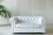 Classic luxury white leather chester sofa in white interior