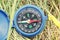 Classic navigation compass on natural background