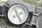 Classic navigation compass on natural background