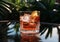 Classic negroni cocktail glass with ice and orange on glass table in summer lounge with palms.Macro.AI Generative