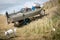 Classic New Zealand beach scene - bull dog guarding aluminium dinghy full of fishing gear