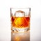 Classic Old Fashioned in a crystal-cut rocks glass isolated on white backdrop