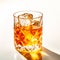 Classic Old Fashioned in a crystal-cut rocks glass isolated on white backdrop