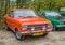 Classic old orange German car Opel Kadett parked