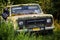 Classic old rusty 4x4 adventure truck in the forest