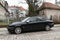 Classic old vintage veteran retro elegant sedan car black Jaguar Sovereign parked