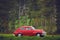 Classic oldtimer vintage two-door car of the 1950s - 1960s on a country road