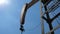Classic onshore land drilling oil well rig in detail with blue sky 4k 25 fps