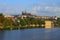 Classic panoramic view of medieval Prague. Scenic landscape of ancient Prague Castle and Saint Vitus Cathedral with Vltava River.