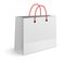 Classic paper shopping bag with red rope handles isolated