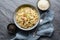 Classic pasta Carbonara, hearty Italian dish made with Spaghetti, egg, fried bacon, topped with grated Parmesan cheese and black p