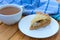 Classic pie with salmon and white fish on wooden board. Composition with fish pie on concrete background with textile