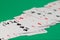 Classic playing cards on green background. Gambling and casino concept.
