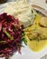 Classic Polish dinner, mashed potatoes with meat in sauce, red cabbage salad, dinner dish, warm food, homemade dinner
