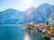 Classic postcard view of famous Hallstatt lakeside town in the Alps moutain ship on a beautiful cold