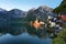 Classic postcard view of famous Hallstatt lakeside town reflecting in Hallstattersee lake in the Austrian Alps in scenic morning l