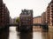 Classic postcard view of Hamburg Speicherstadt Wasserschloss warehouse district in Elbe harbour port HafenCity Germany