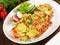 Classic Potato Omelette with Vegetables and Onions on wooden Background