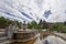 Classic public city park with a fountain, flowers and statues in the German city of Baden Baden, Europe