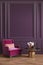 Classic purple, ultraviolet, colorful, interior with armchair, coffee table, flowers and wall moldings.