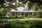 classic ranch house, with wrap-around porch, surrounded by lush greenery