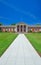 Classic Red Brick Building With Greek White Column Entrance