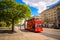 Classic red city sightseeing bus  at the street of Dresden