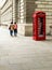 Classic Red London Telephone Box with Two People