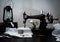 Classic retro style manual sewing machine ready for work, kerosene lamp