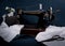 Classic retro style manual sewing machine ready for work, scissors, fabric and old