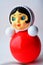 Classic Russian red toy `Nevalyashka` - roly-poly on the white, retro